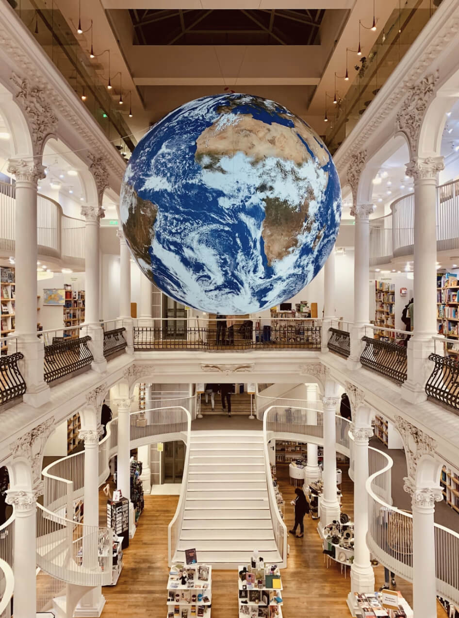 Artist at an easel, seen from behind — creative depth and focused attention