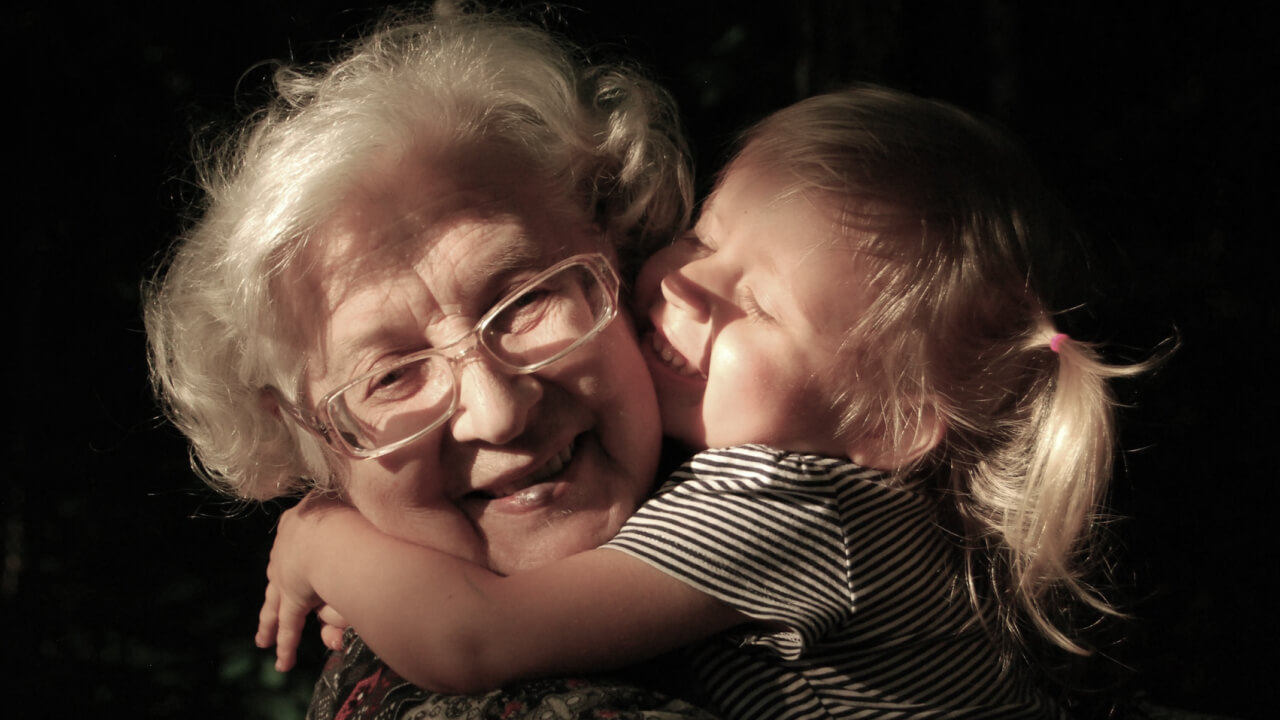Person crossing an ancient stone bridge through mist — serving what unfolds